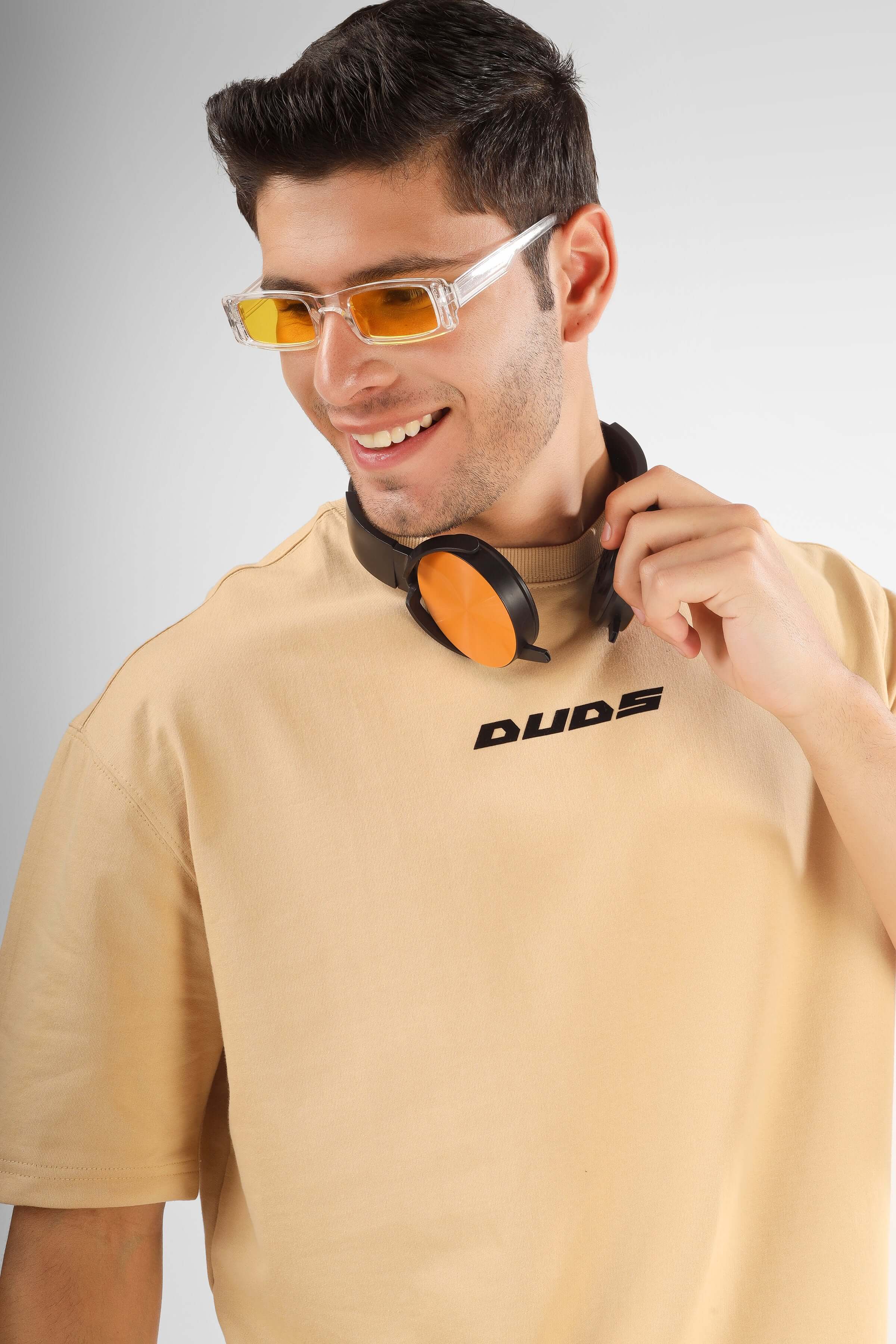 POSITIVE MINDSET OVER-SIZED T-SHIRT NUDE, premium cotton French terry, featuring man with headphones and orange sunglasses.