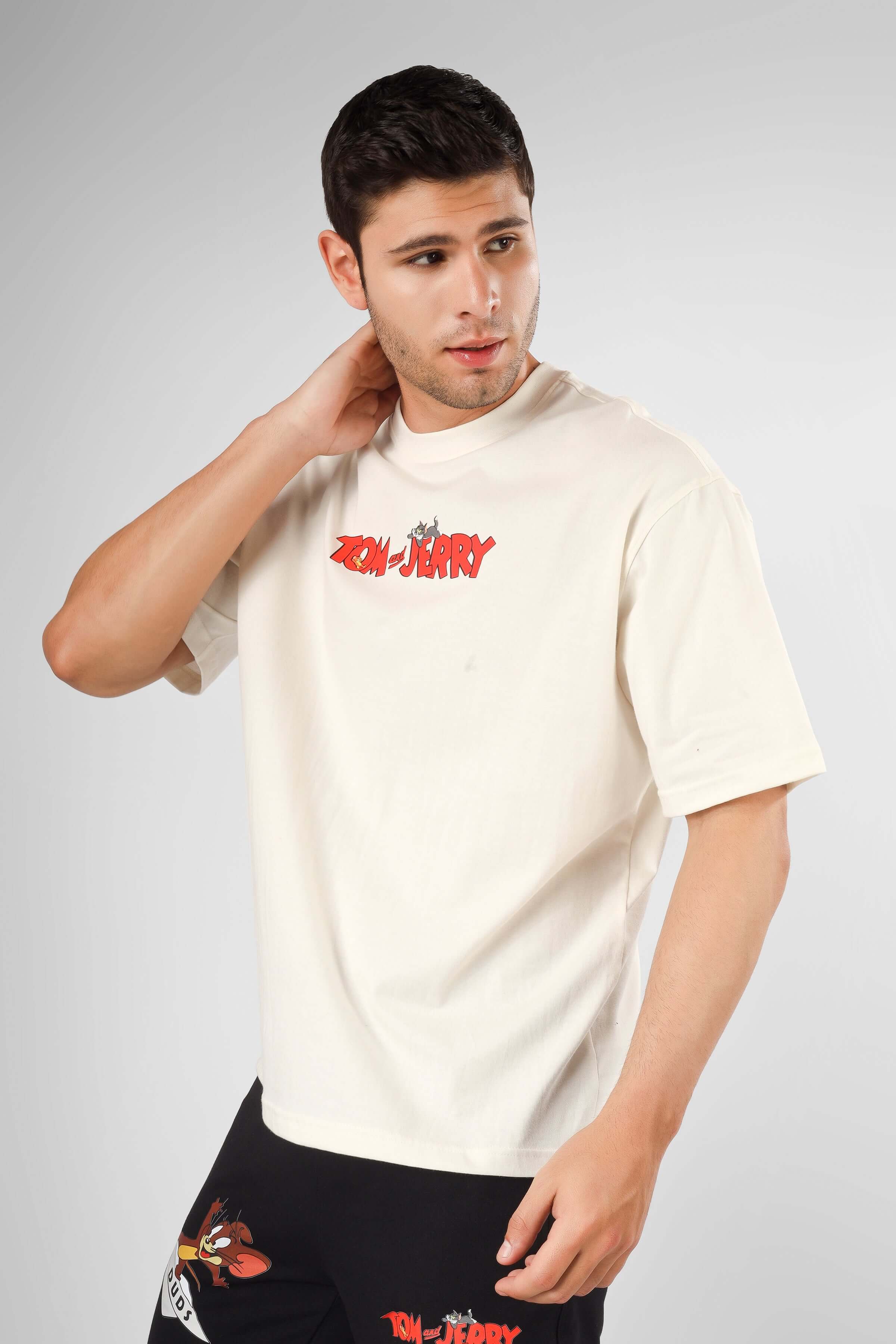 Model wearing TOM & JERRY OVER-SIZED T-SHIRT CREAM, 100% Cotton Premium Heavy Gauge Fabric, 200 GSM Bio-washed.