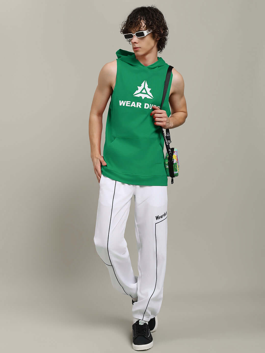 Model wearing CYBRAN green gym hooded T-shirt with custom fit option, styled for active wear, ideal for gym or casual outings.