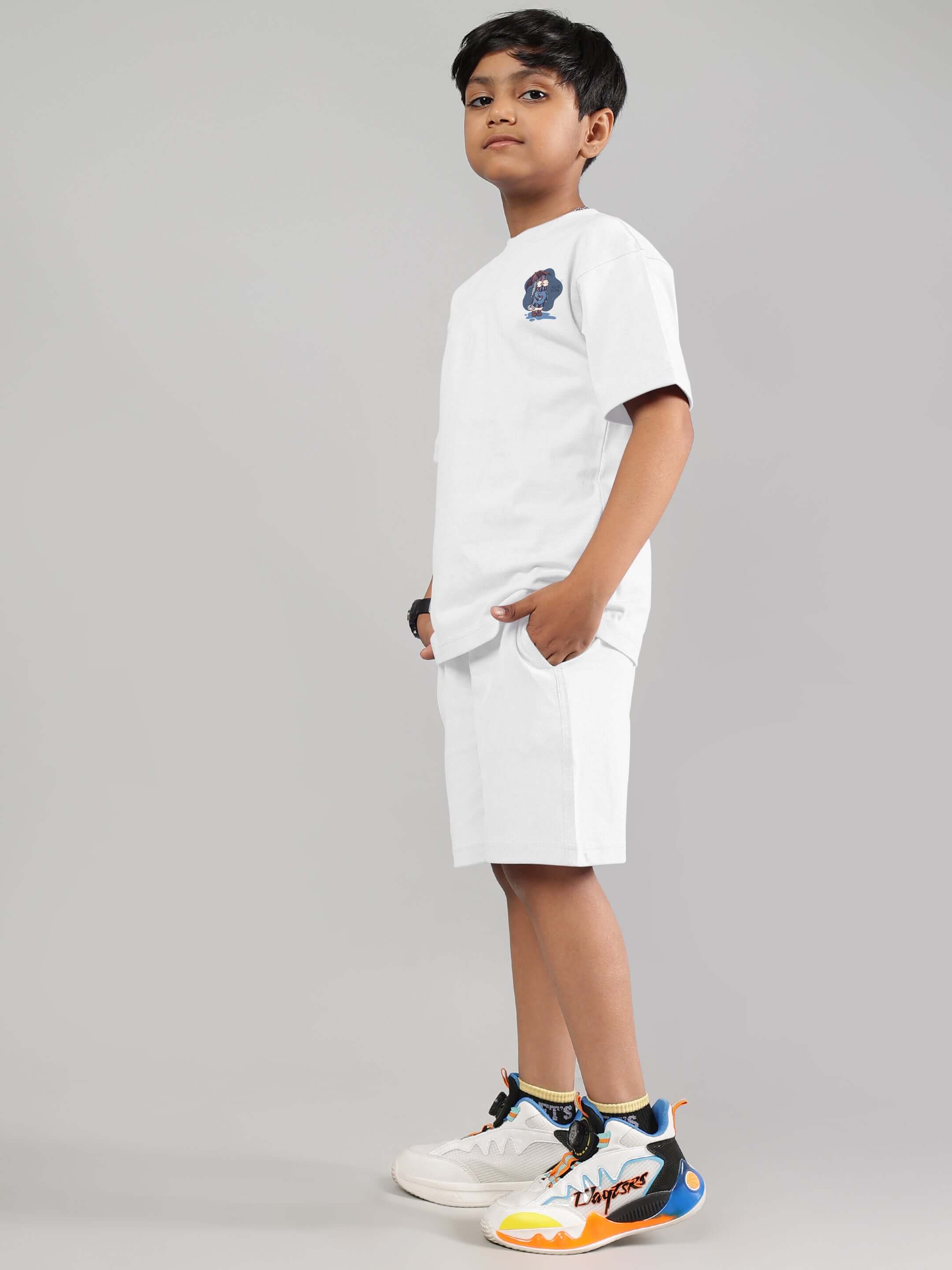Young boy in stylish white Blue Lapin Co-ord, perfect for boys and girls. Made-to-order by DUDS with custom fit option available.
