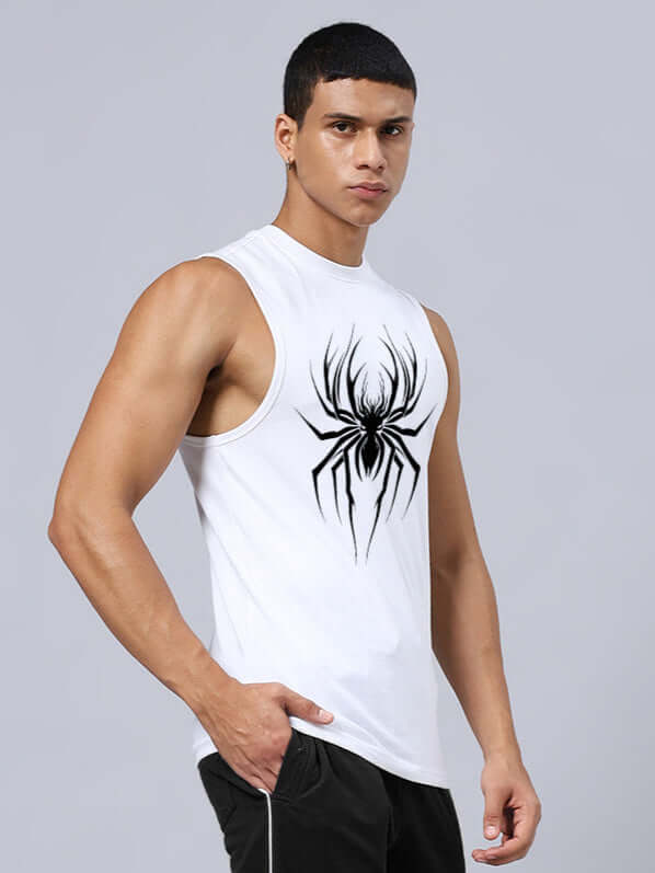 Man wearing a white relaxed fit gym t-shirt featuring a bold spider print, showcasing muscular build and fitness style.