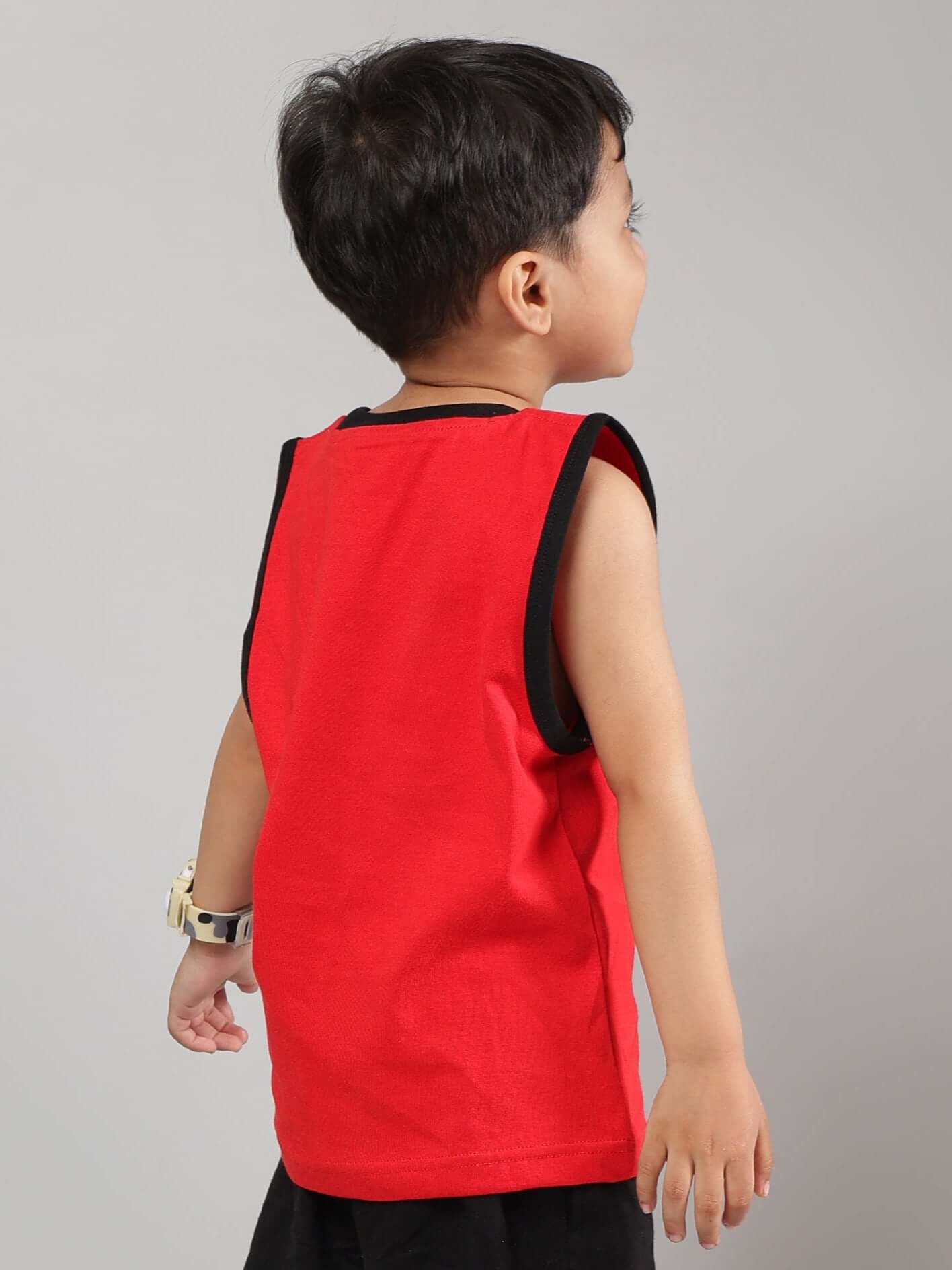 Young boy wearing a red AMIGA t-shirt from DUDS, customized for boys and girls. Ideal for unique wardrobe additions.