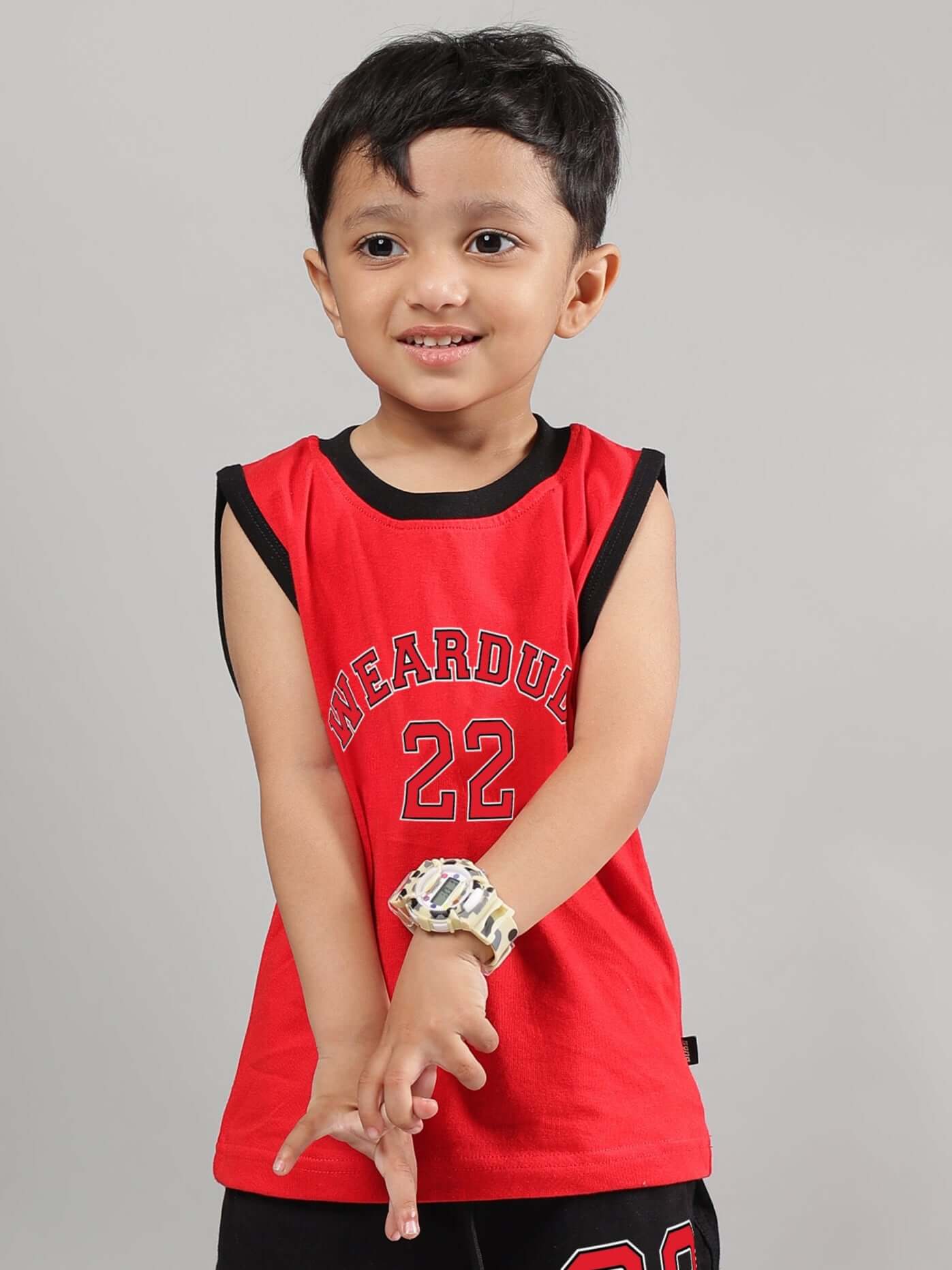 Child wearing AMIGA red t-shirt for boys and girls, showing sporty style. Made to order by DUDS with custom fit option available.