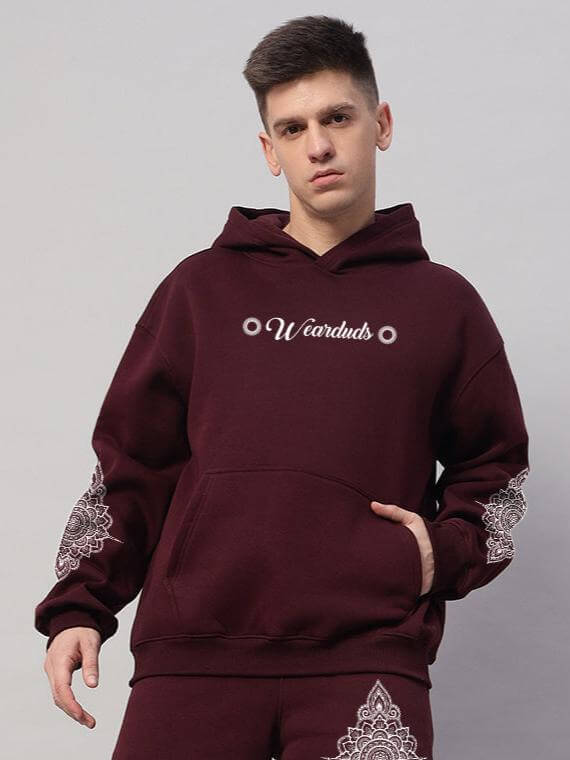 Person wearing Yantra Fleece Hoodie in wine color, showcasing stylish design and cozy fleece fabric for modern streetwear.