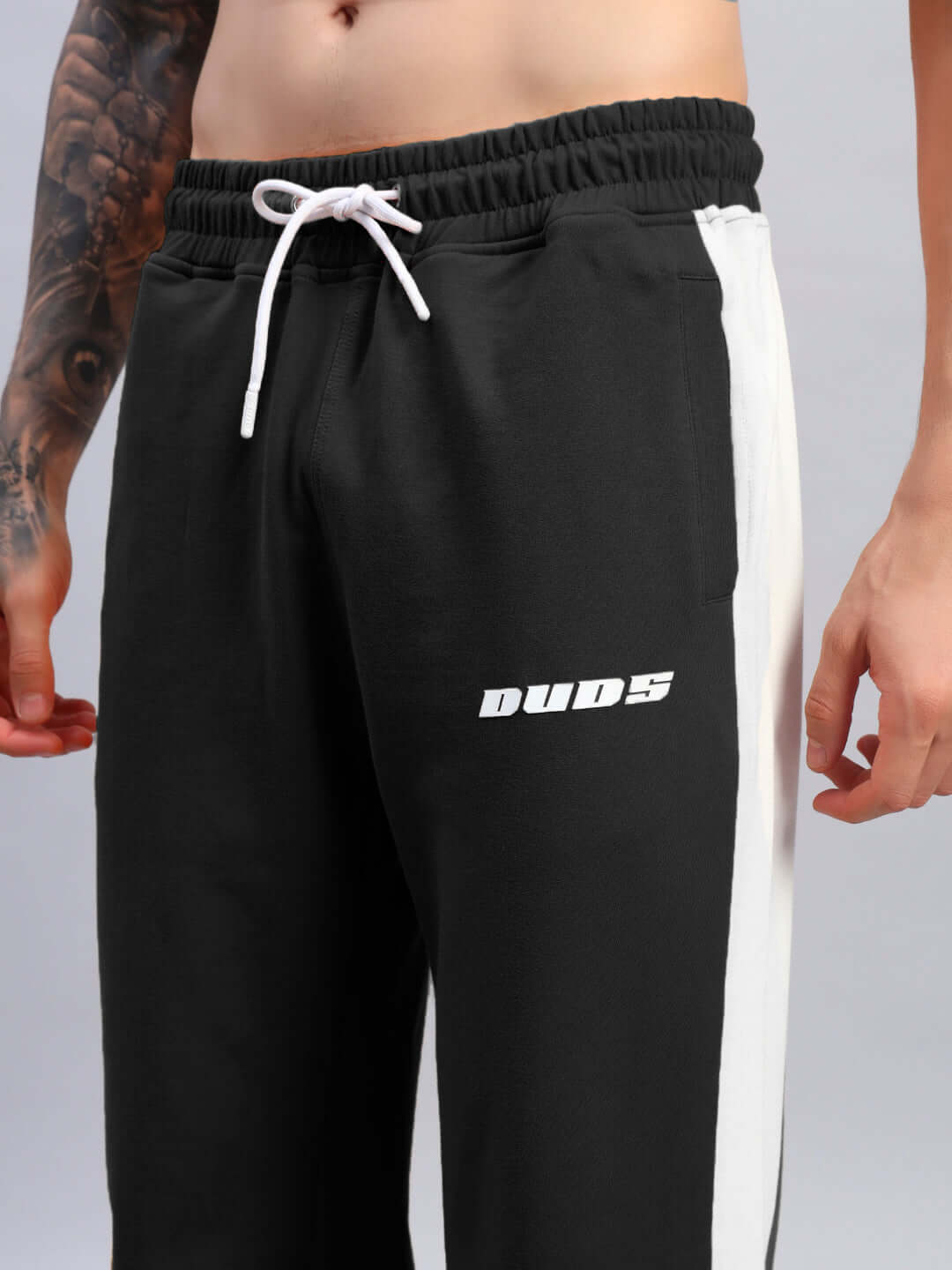 Black-white Lightning Bolt relaxed fit joggers from DUDS with customizable size option, shown on a model.