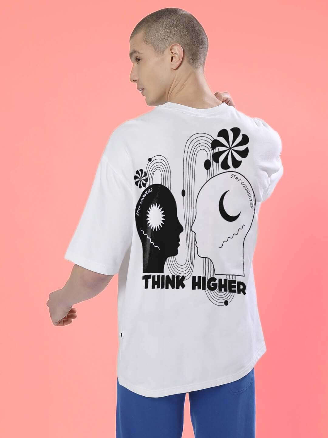 Model wearing THINK HIGHER OVER-SIZED T-SHIRT WHITE with graphic design on back, made of premium cotton and elastane blend.