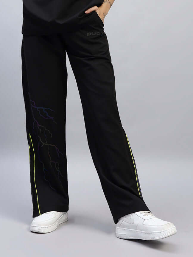 Women's Salvo Reflector Relaxed-Fit Black Joggers with custom fit options, showcasing comfort and style, paired with casual white sneakers.