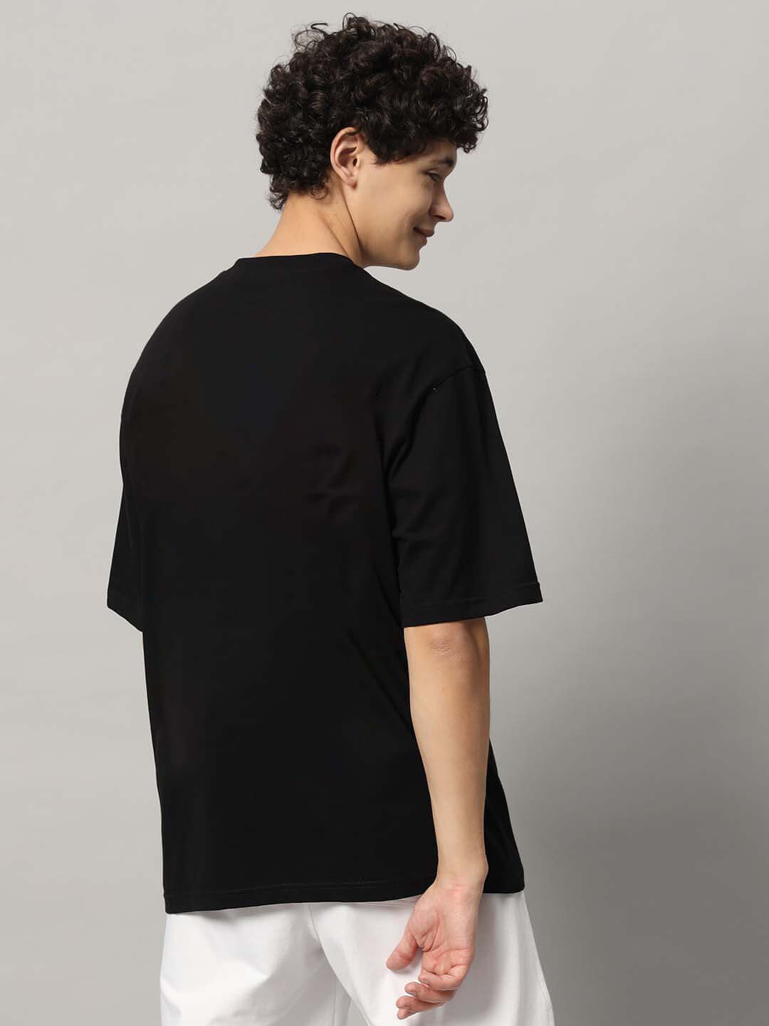 Back view of TASTER OVER-SIZED T-SHIRT BLACK on model, available with Custom Fit option for prepaid orders.