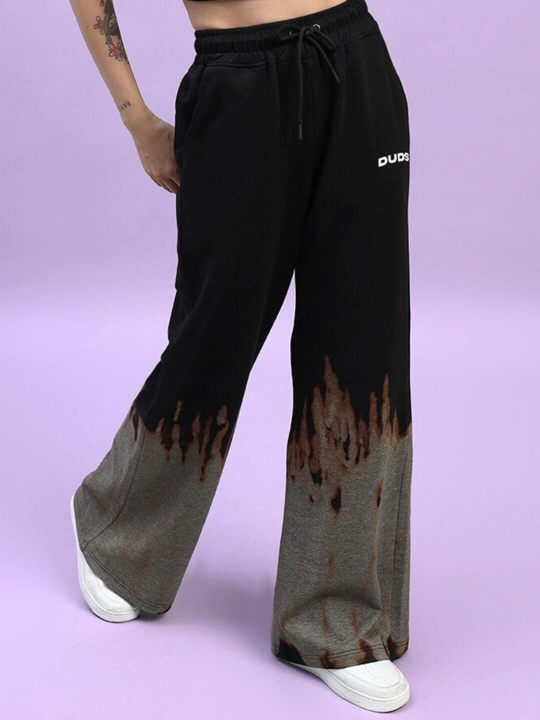 Women's Fire Flame Baggy Tie-Dye Jogger Pants in Black by DUDS, featuring a unique flame design and customizable fit options.