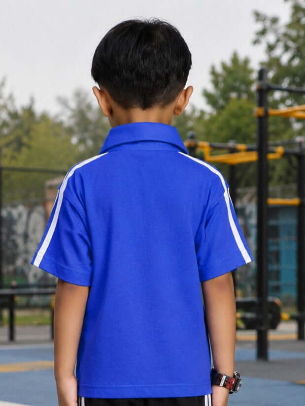 CHAMPION TRACK POLO T-SHIRT FOR BOYS GIRLS BLUE worn by a child from the back, showcasing its vibrant blue color and sporty design.