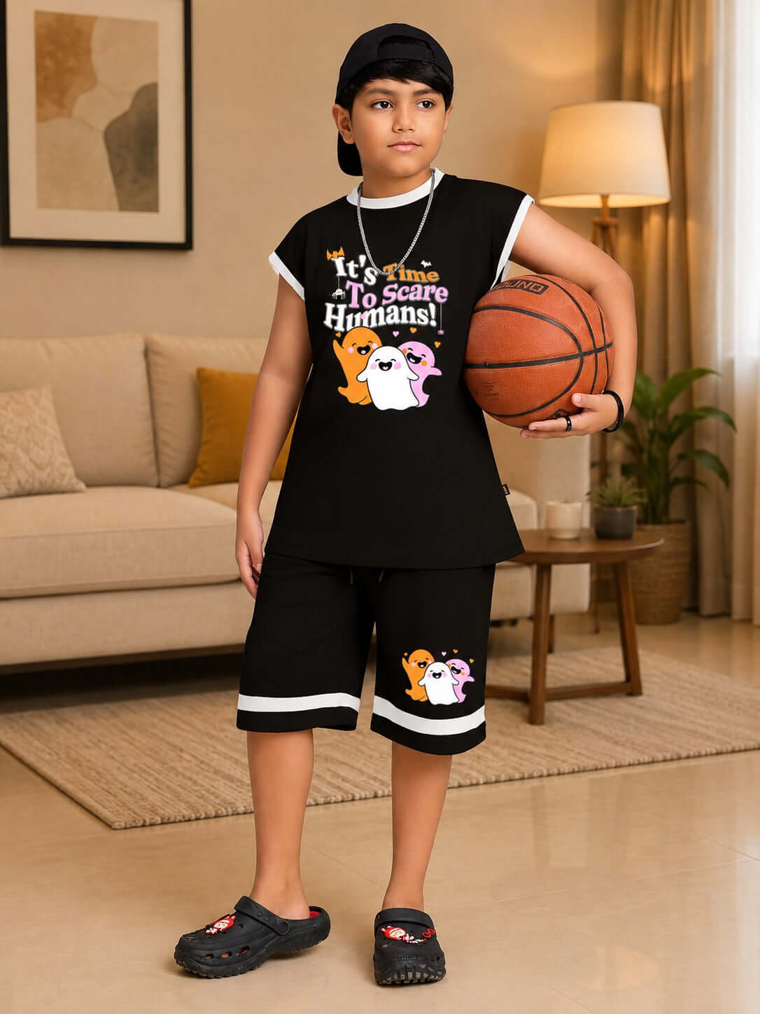 GHOST GRAPHIC TANK SLEEVELESS T-SHIRT FOR BOYS GIRLS BLACK worn by a boy holding a basketball.