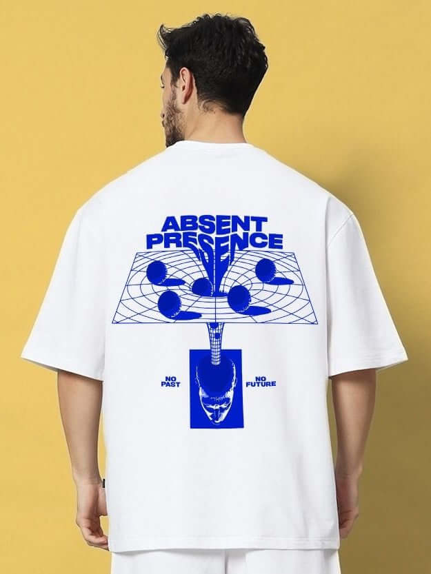 Back view of a model wearing ABSENT PRESENT OVER-SIZED T-SHIRT WHITE with blue graphic print, showcasing minimal streetwear style.