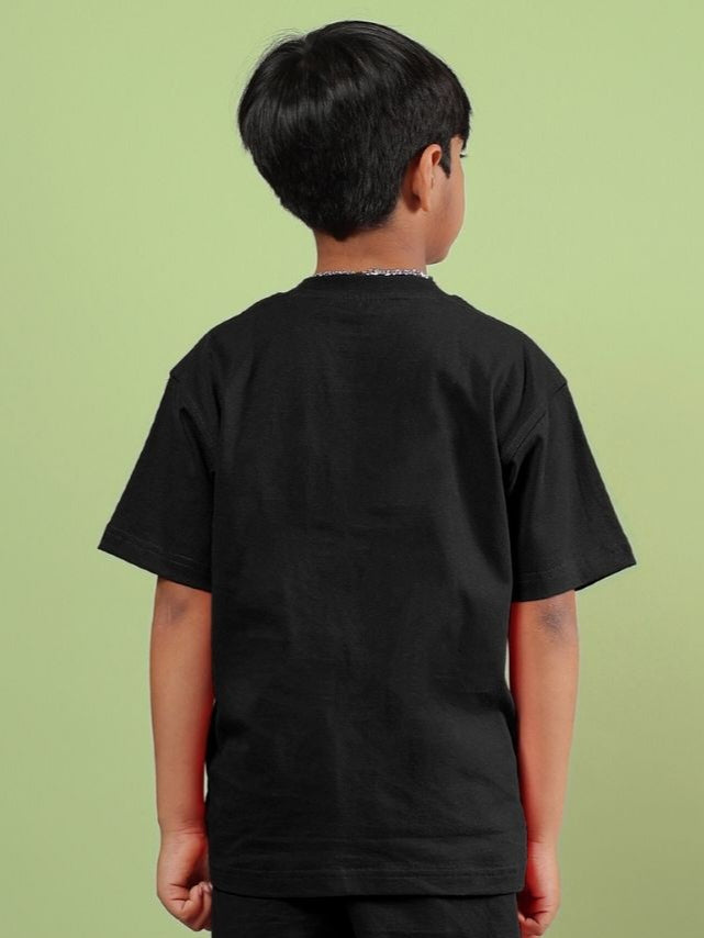 Back view of unisex ACE black t-shirt for boys and girls worn by child, showcasing comfortable fit and timeless style.