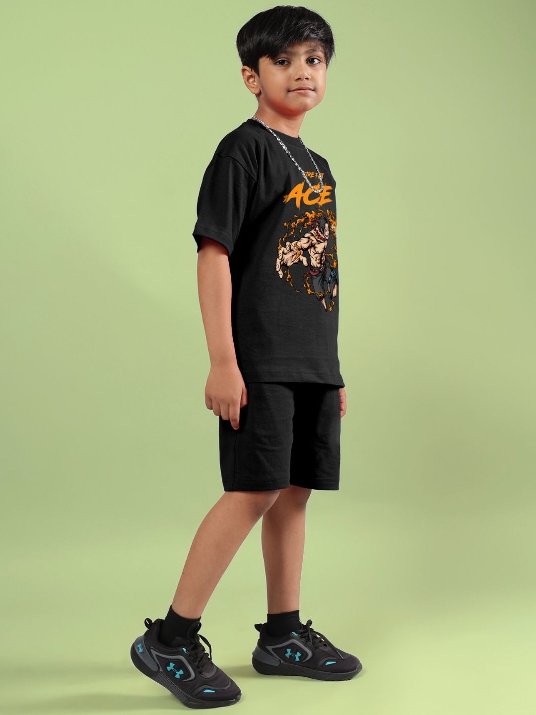 Child wearing ACE co-ord set in black, featuring a stylish t-shirt and shorts ensemble perfect for boys and girls.