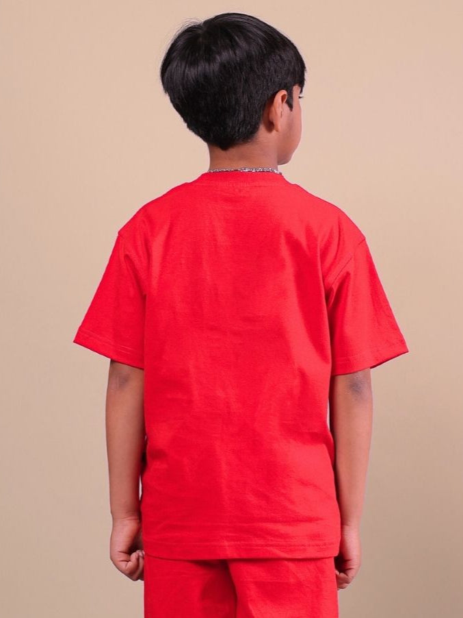 Child wearing ACE unisex red t-shirt, back view, showing vibrant color and comfortable fit.