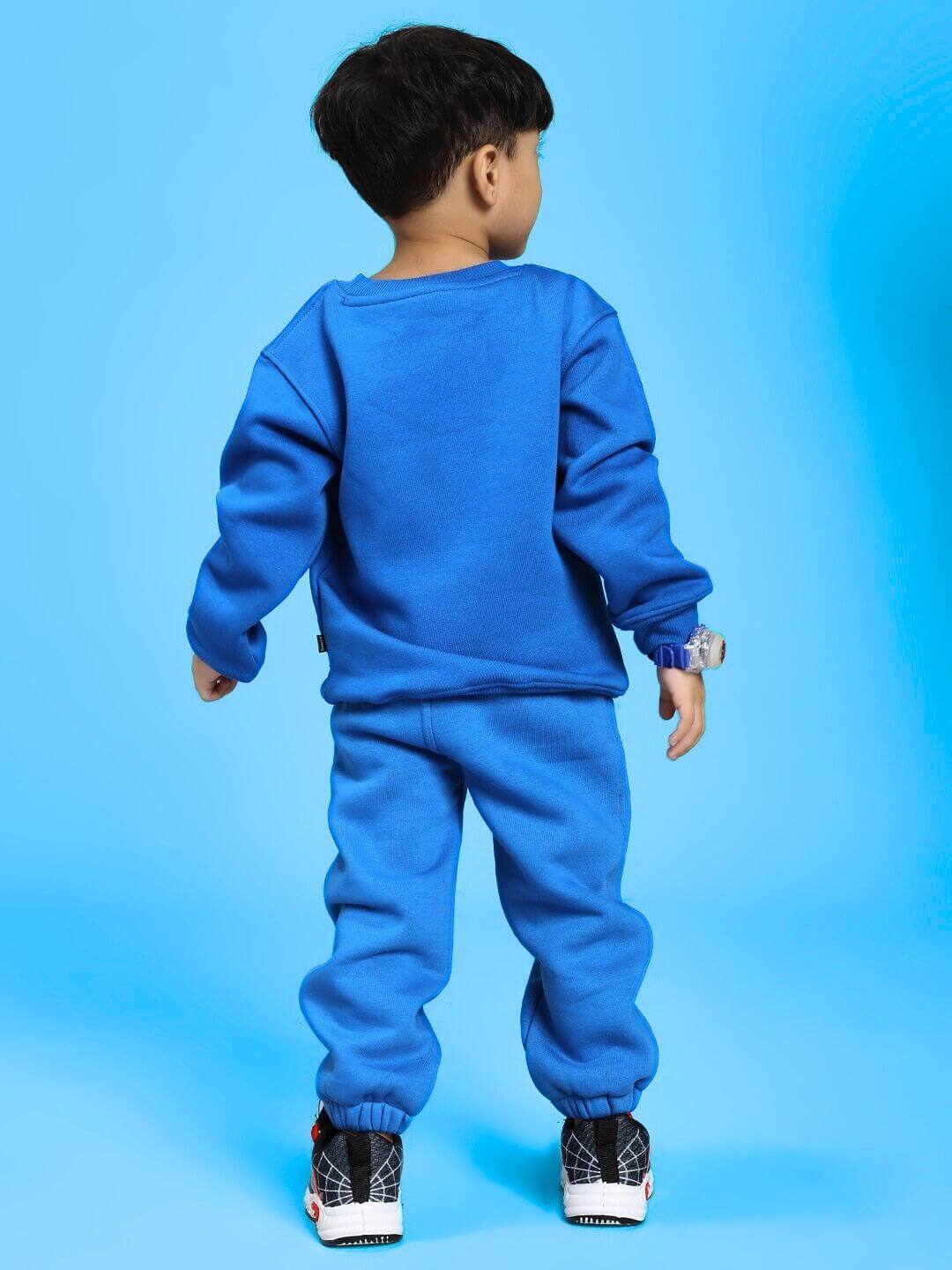 Child wearing ADVENTURE BUNNY CO-ORD FOR BOYS AND GIRLS BLUE showing back view of blue fleece outfit for kids.