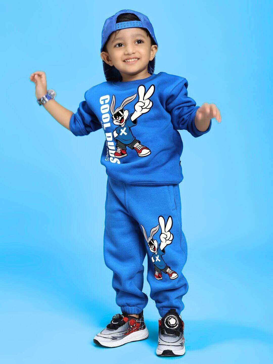 Child wearing Adventure Bunny Fleece Sweatshirt for Boys and Girls Blue with matching pants