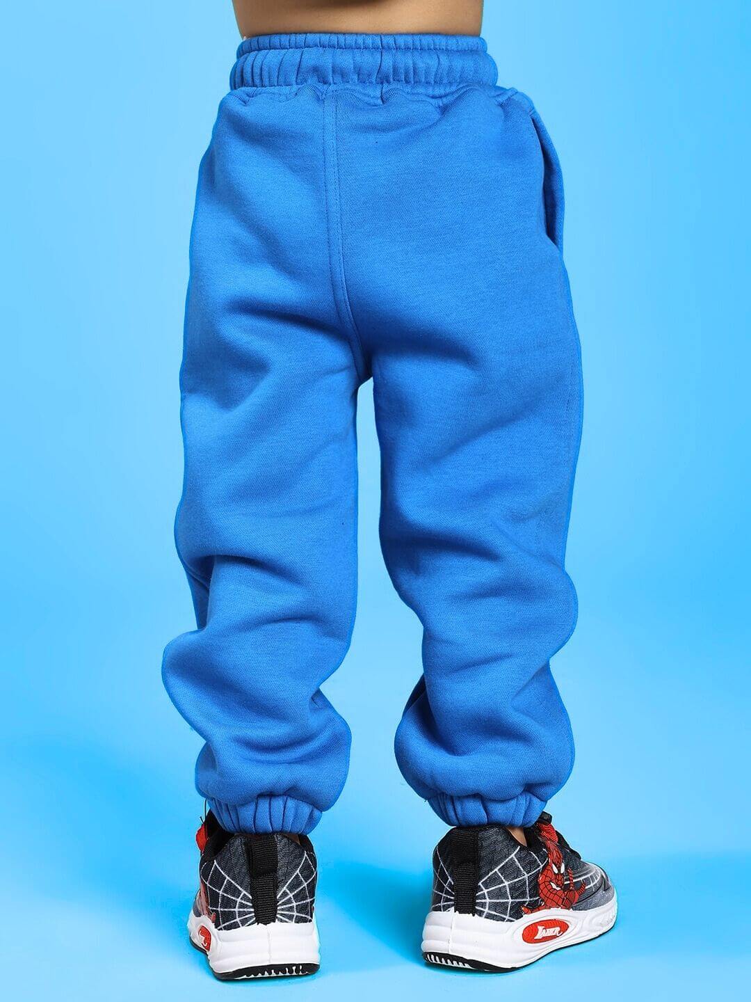 Child wearing Adventure Bunny Fleece Jogger for Boys and Girls Blue, showcasing comfort and style with ultra-soft blue fleece material.