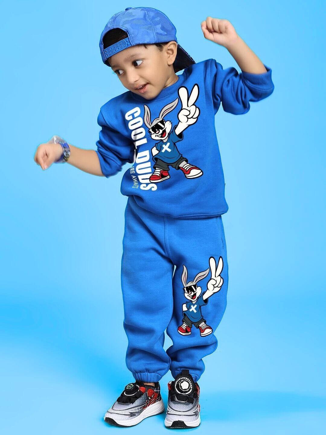 Child wearing Adventure Bunny Fleece Sweatshirt for Boys and Girls Blue, smiling and playing in comfy casual outfit.