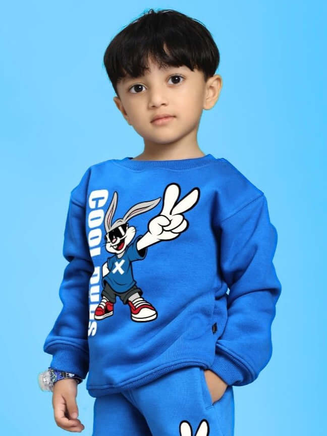 Child wearing Adventure Bunny Fleece Sweatshirt for Boys and Girls Blue, displaying a cartoon bunny design on a light blue background.