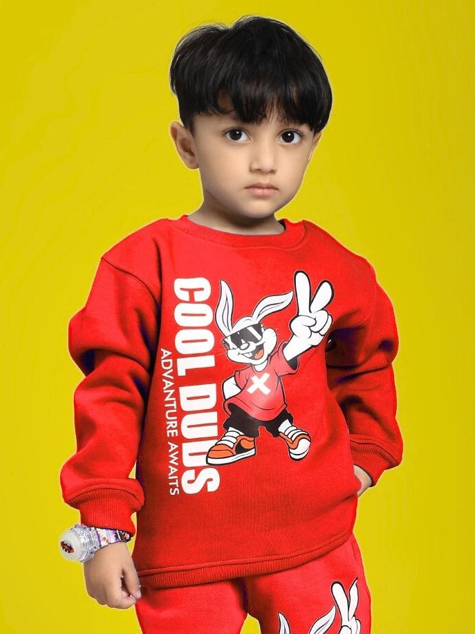 Child wearing ADVENTURE BUNNY FLEECE SWEATSHIRT FOR BOYS AND GIRLS RED with cool graphics, yellow background