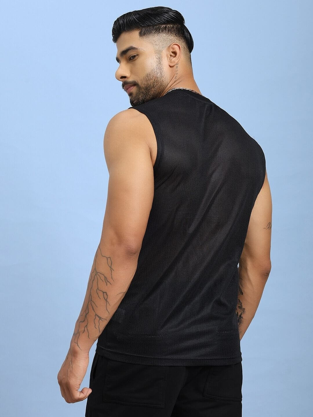 Rear view of man wearing AIR-FLOW REGULAR FIT T-SHIRT BLACK showcasing its comfort and fit.