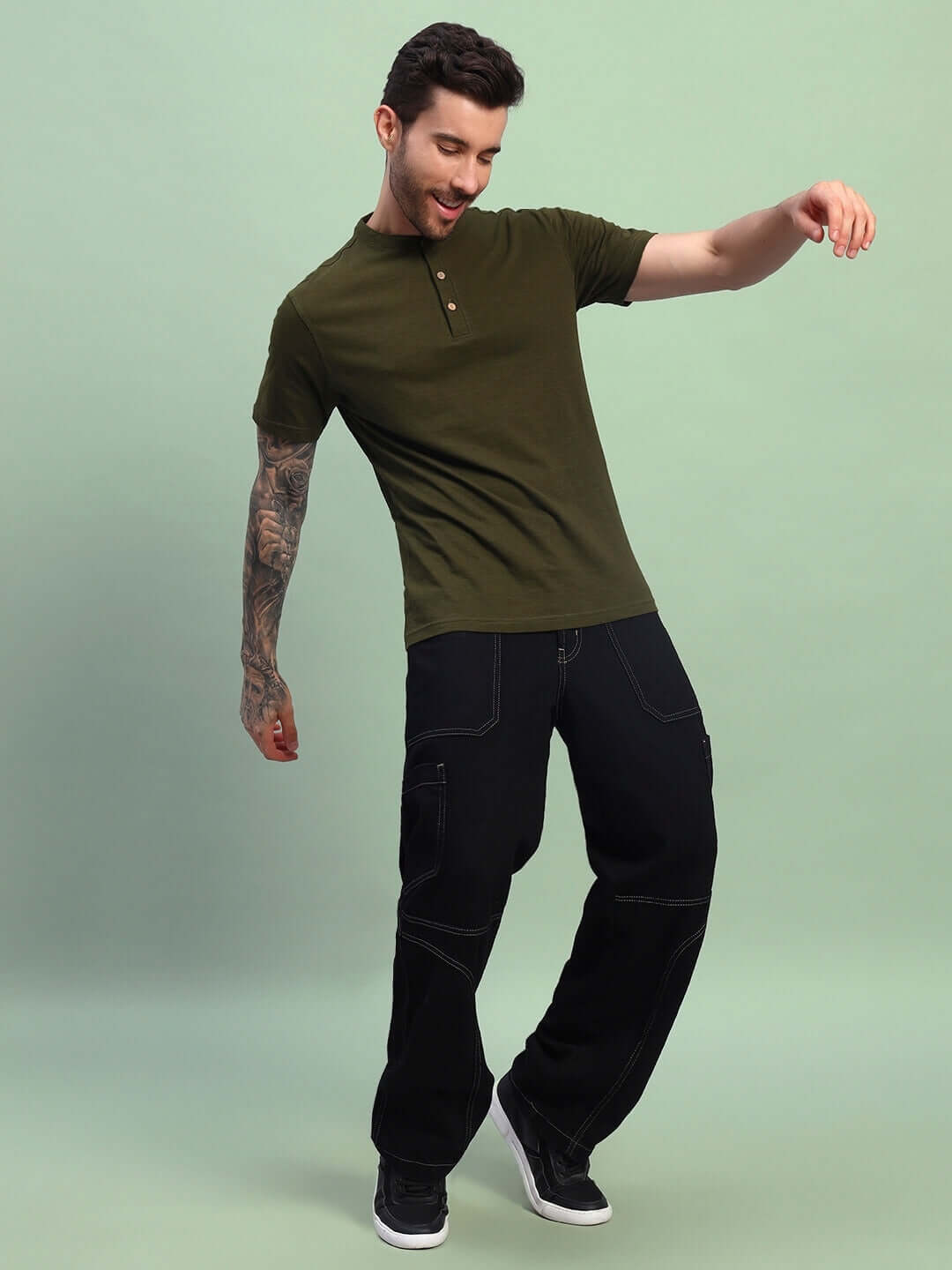 Model wearing olive green Albet regular fit t-shirt made of premium cotton slub fabric, showcasing casual style.