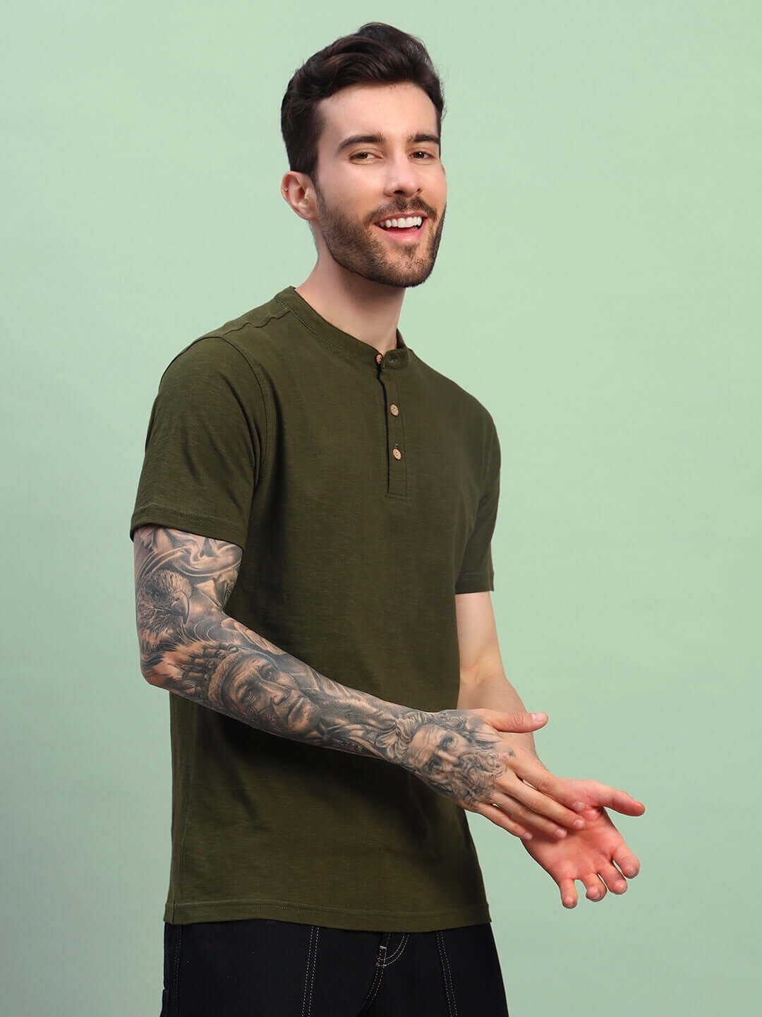 Man wearing ALBET Regular Fit T-Shirt in Olive Green, made of premium heavy cotton slub fabric, perfect for casual wear.