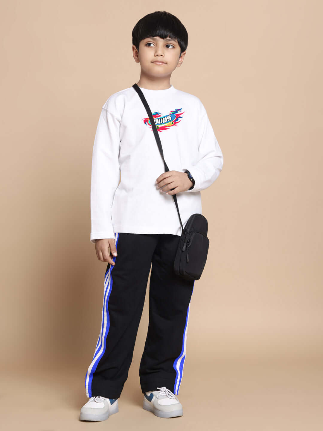 Child wearing white-black ALIEN CO-ORD set with a crossbody bag, showcasing the comfortable style for boys and girls by DUDS.