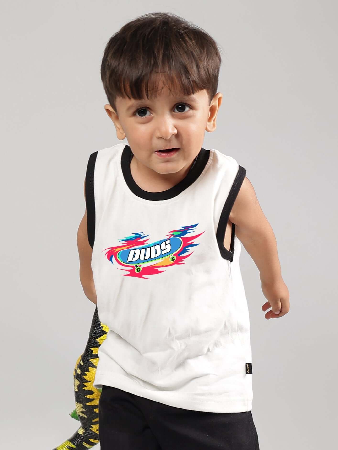 Young child wearing off-white Alien Summer T-shirt by DUDS, featuring a colorful logo, suitable for boys and girls, custom fit available.