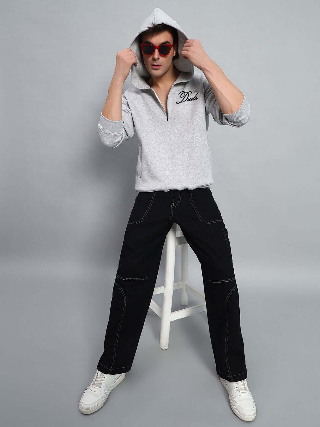 Model wearing AMARILLO FLEECE HOODIE MELANGE GREY with red sunglasses and black pants.