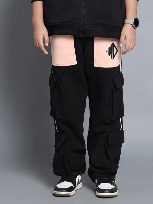 Child wearing black and beige fleece jogger pants with angel wings design, showcasing style and comfort for boys and girls.