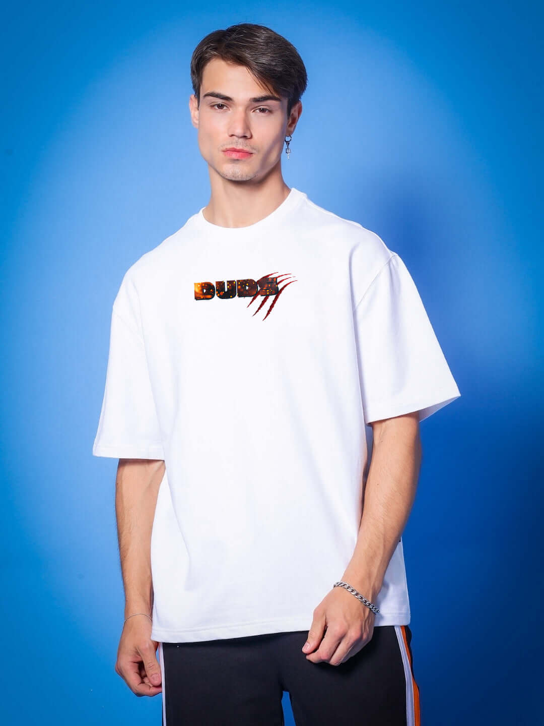 Model wearing the ANGRY PANTHER OVERSIZED T-SHIRT WHITE with bold street style features.