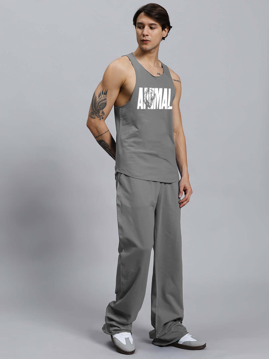 Model wearing ANIMAL PRINTED RELAXED FIT CO-ORD SET GREY, unisex with joggers and elasticated waistband, 100% cotton bio-washed.