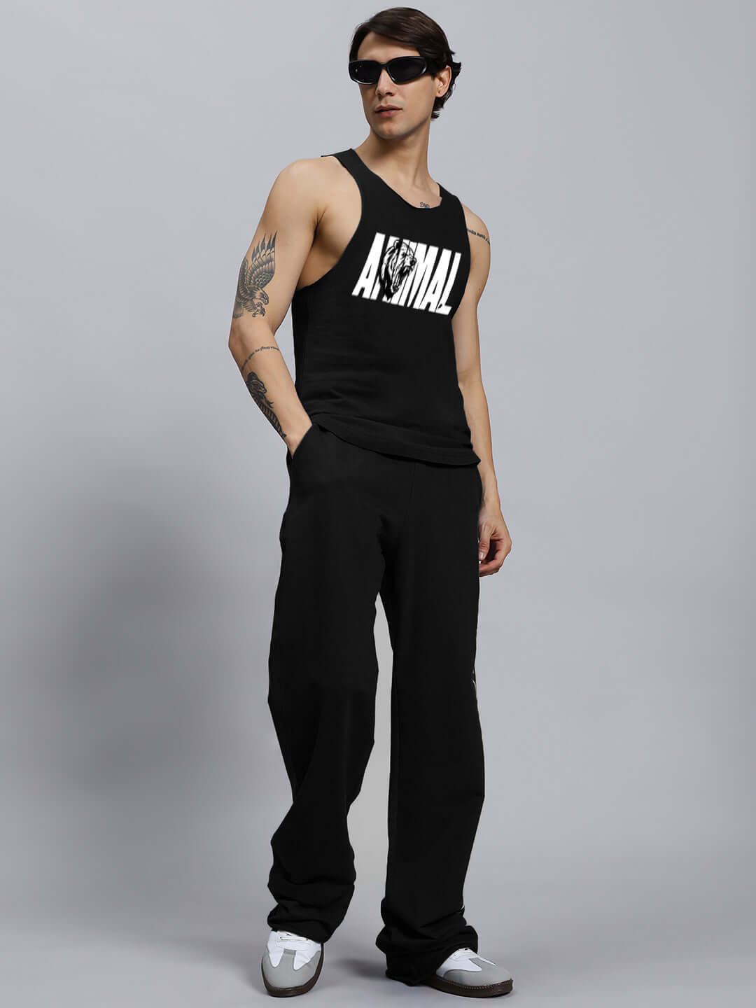 Model wearing ANIMAL PRINTED RELAXED FIT CO-ORD SET BLACK with unisex joggers and sleeveless top.