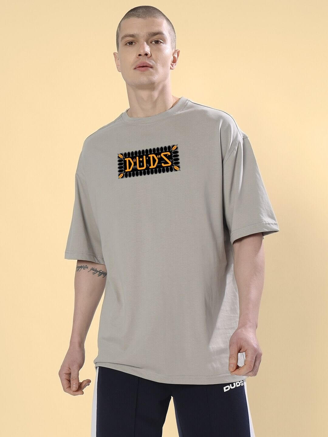 Model wearing ANUBIS EGYPTIAN PRINTED OVERSIZED T-SHIRT GREY featuring detailed Egyptian-inspired Anubis artwork, perfect for cultural fashion.