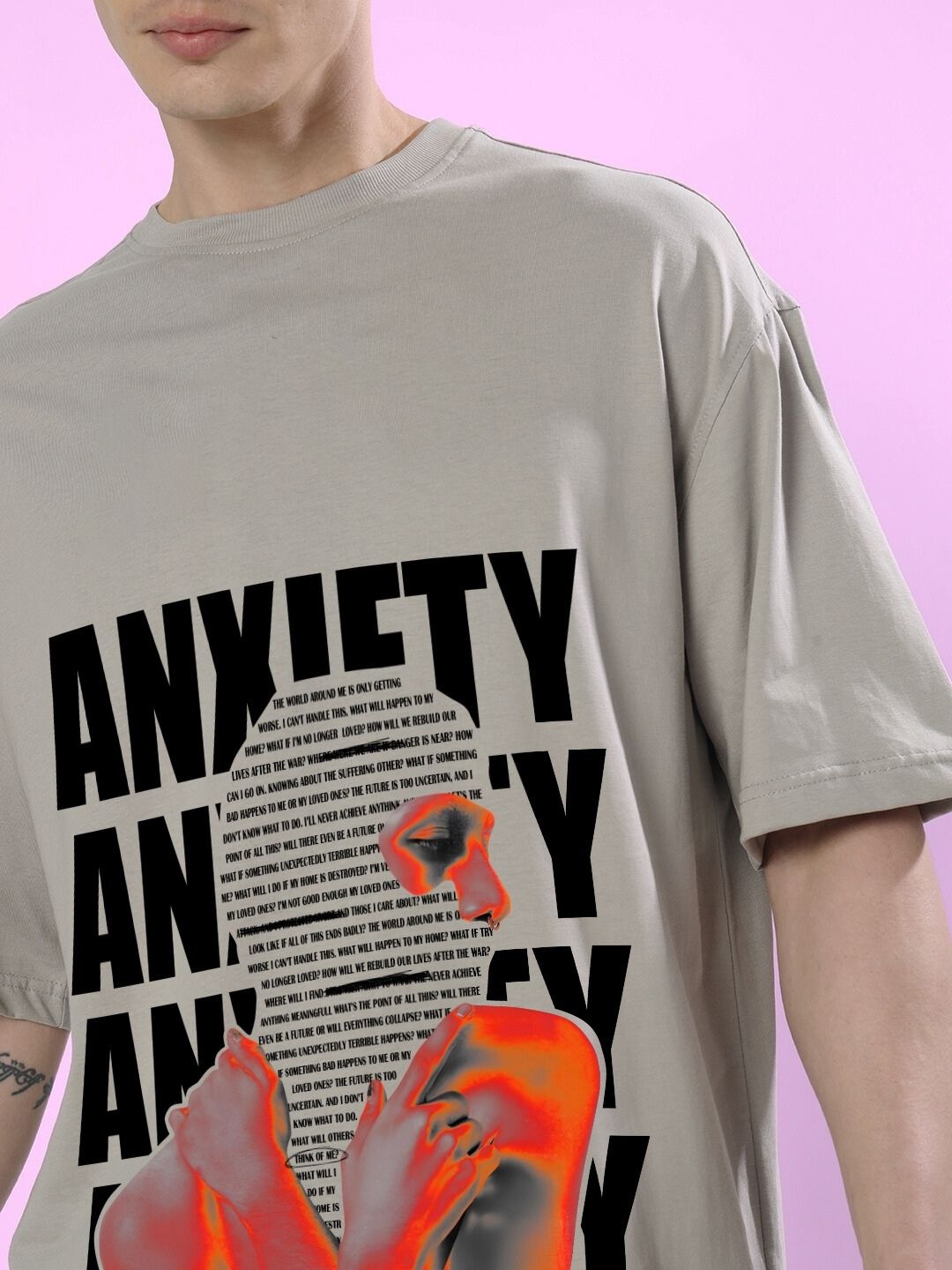 Model wearing ANXIETY OVER-SIZED T-SHIRT GREY with bold text design
