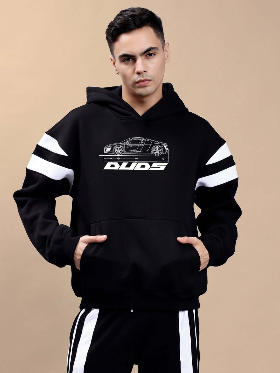 Model wearing AUDI R8 FLEECE COLORBLOCK OVERSIZE HOODIE BLACK with sporty detailing and relaxed fit, ideal for Gen-Z streetwear fashion.