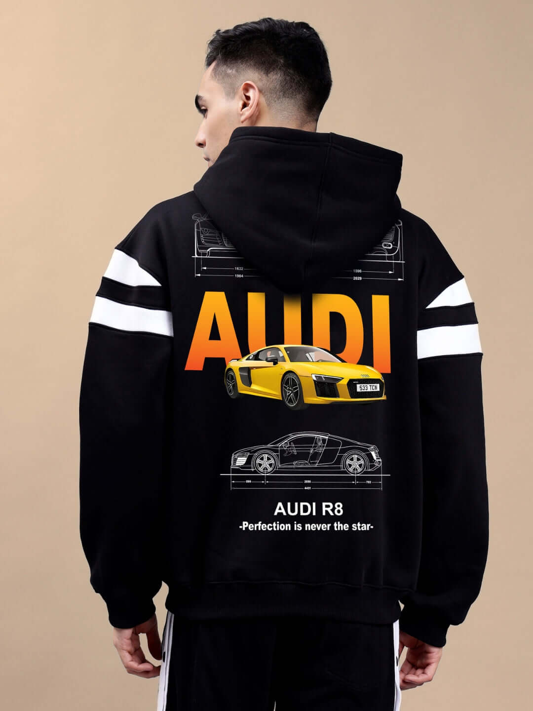 Model wearing AUDI R8 FLEECE COLORBLOCK OVERSIZE HOODIE BLACK with sporty detail, showcasing premium fleece and trendy streetwear style.