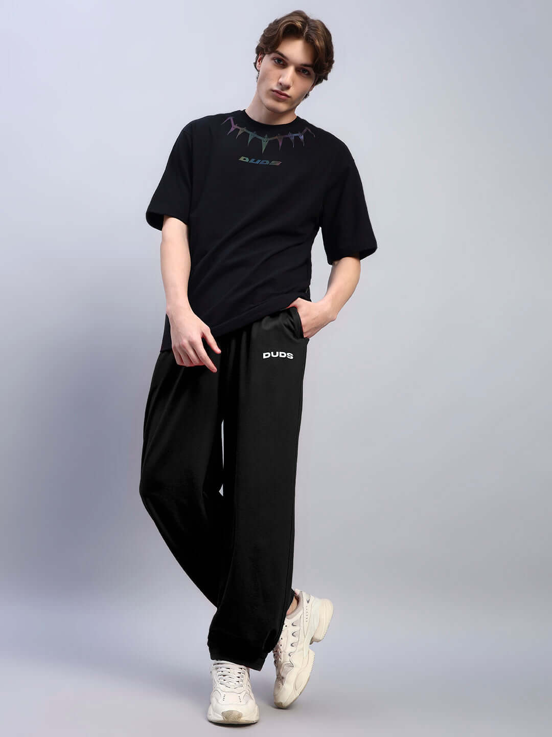 Person wearing AUSTRIAN RELAXED-FIT JOGGERS BLACK with casual t-shirt.
