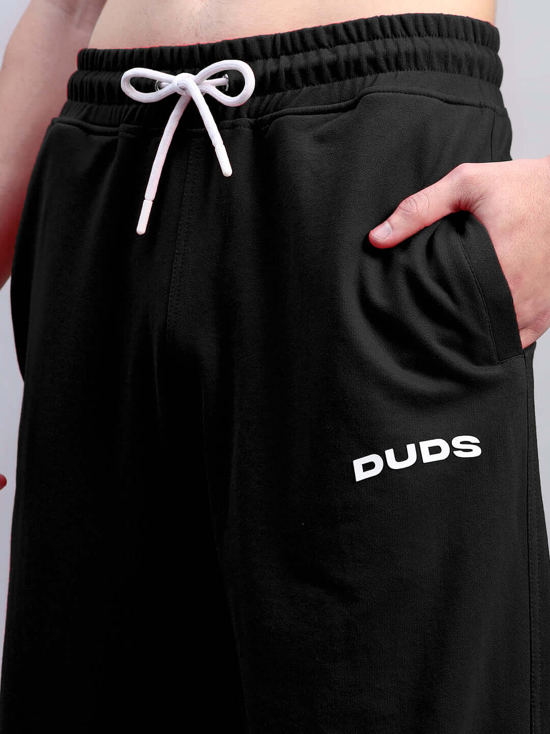 AUSTRIAN RELAXED-FIT JOGGERS BLACK with drawstring waistband and pocket detail.