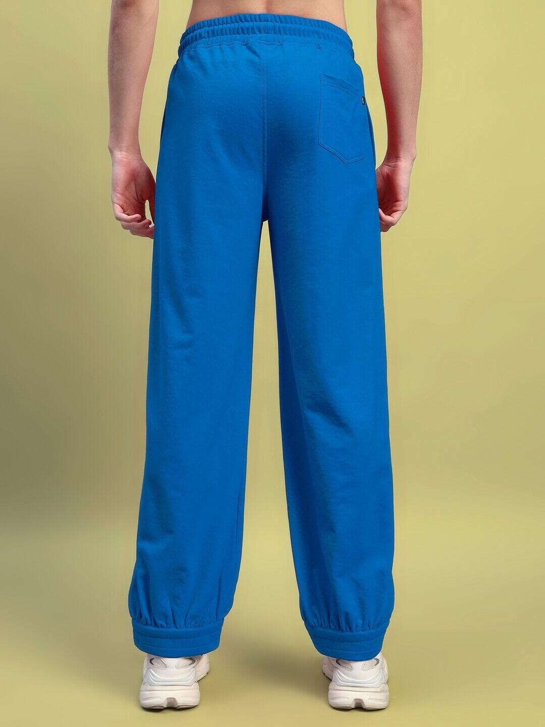 Rear view of AUSTRIAN RELAXED-FIT JOGGERS BLUE showcasing elastic waistband and premium fabric.