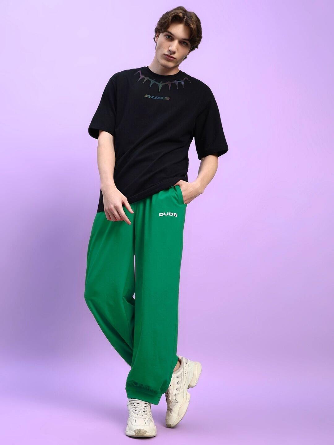 Model wearing Austrian Relaxed-Fit Joggers Green in a casual streetwear outfit.