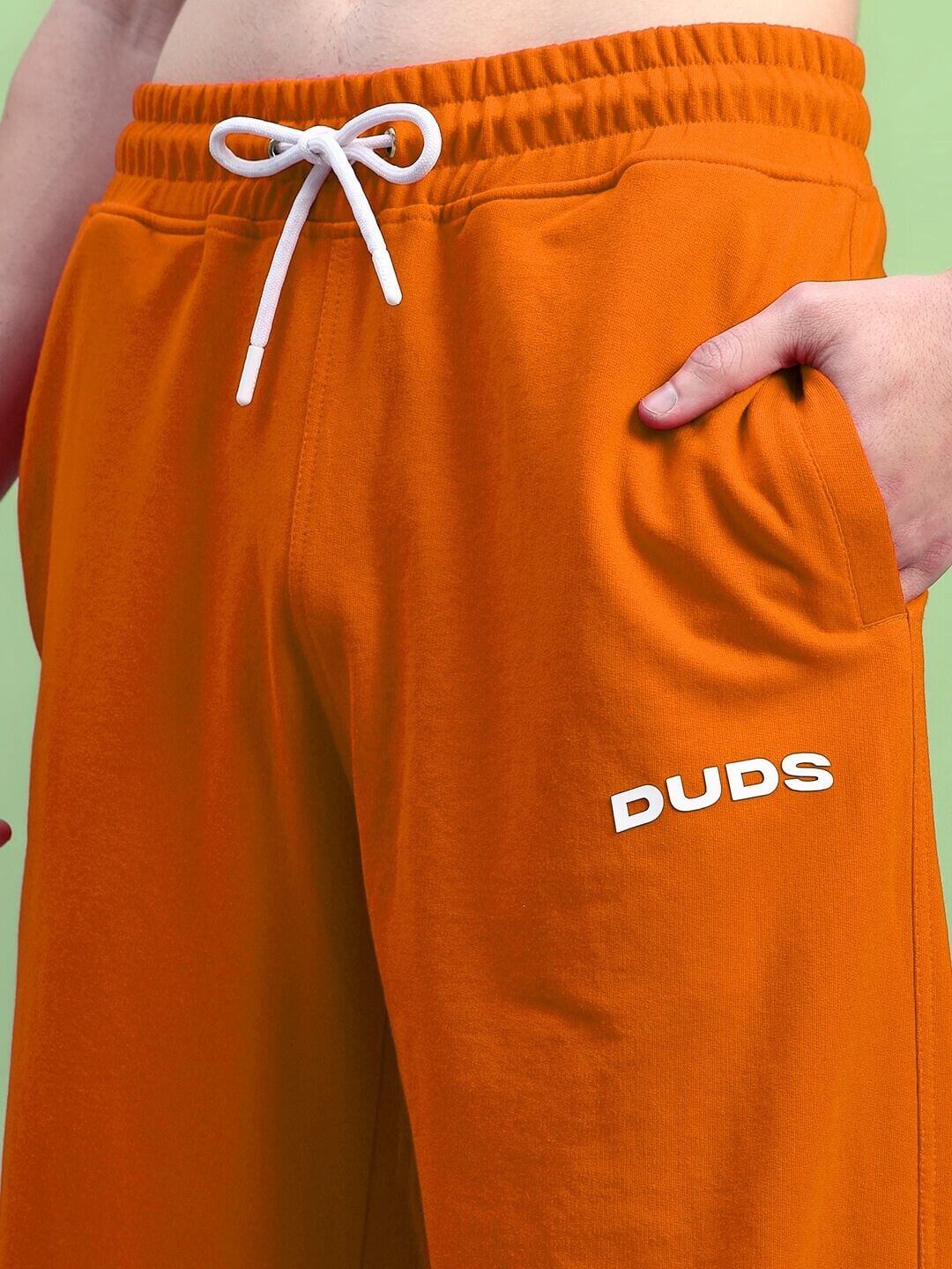 AUSTRIAN RELAXED-FIT JOGGERS ORANGE with elastic waistband and side pocket details.
