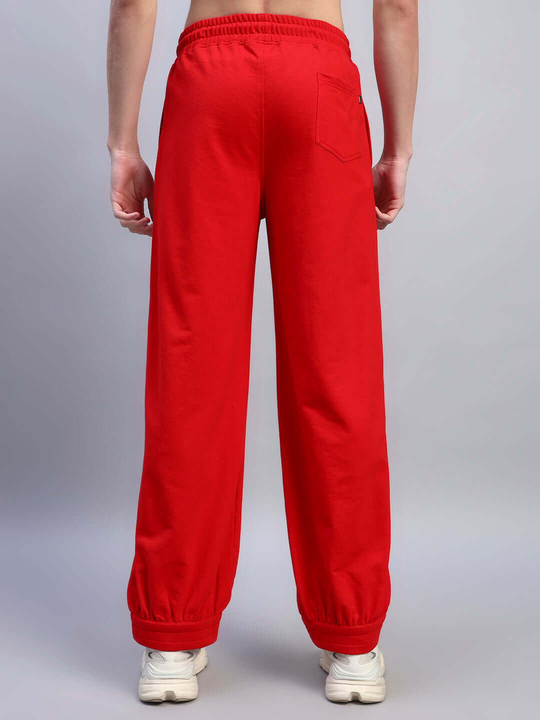 Back view of AUSTRIAN RELAXED-FIT JOGGERS RED showcasing vibrant color and relaxed-fit design for casual style.