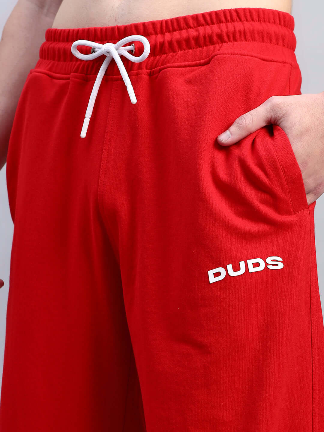 AUSTRIAN RELAXED-FIT JOGGERS RED with drawstring waistband, vibrant red hue, and side pockets for comfort and style.
