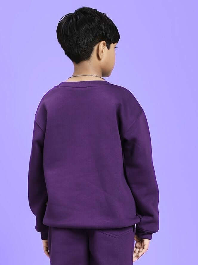 Child wearing AUTHENTIC RIDER FLEECE SWEATSHIRT FOR BOYS AND GIRLS PURPLE, showcasing its cozy and stylish design.