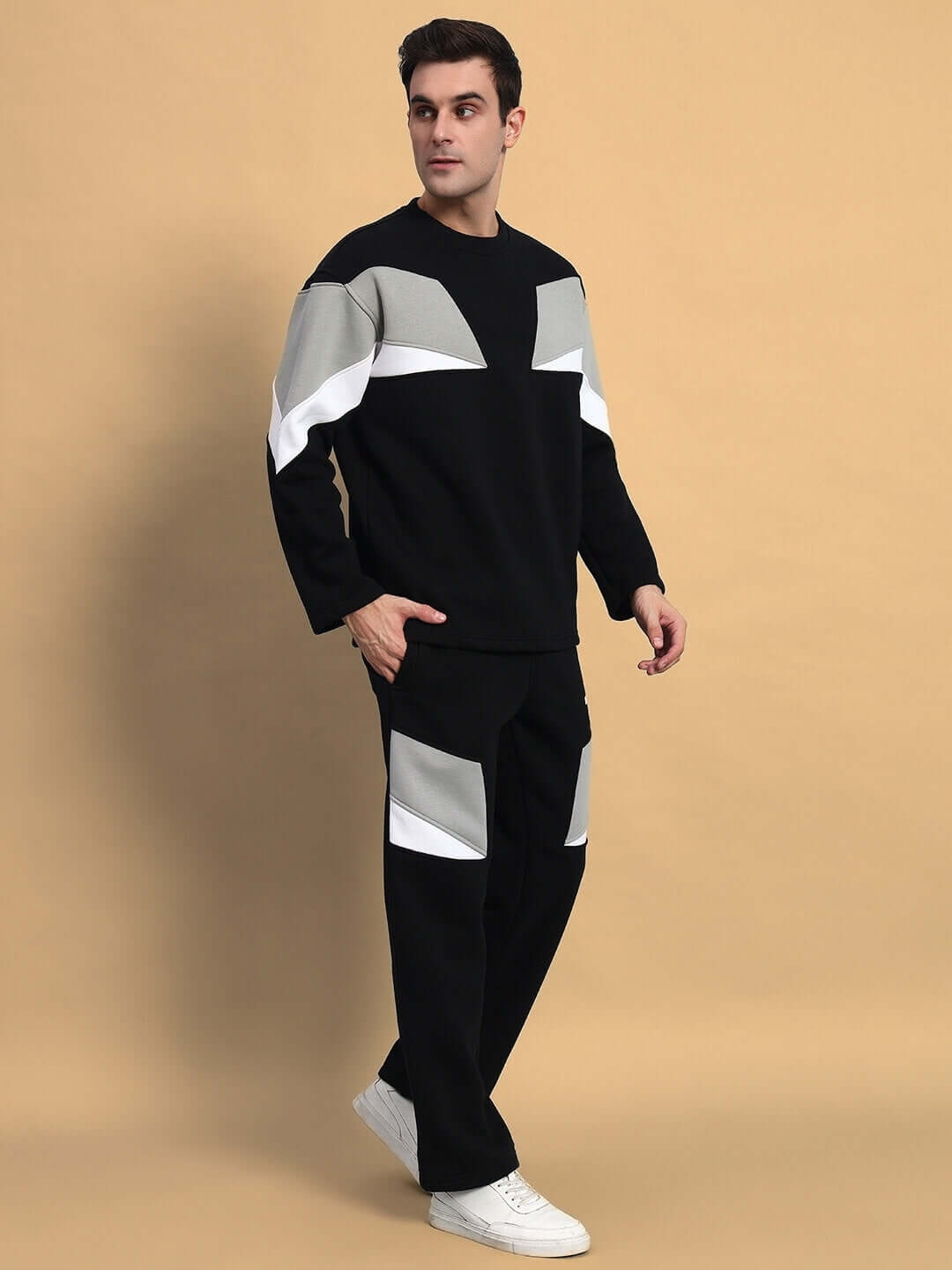 Man wearing AVIATOR FLEECE COLORBLOCK CO-ORD BLACK set, featuring black fleece with modern colorblock design, perfect for casual luxury.