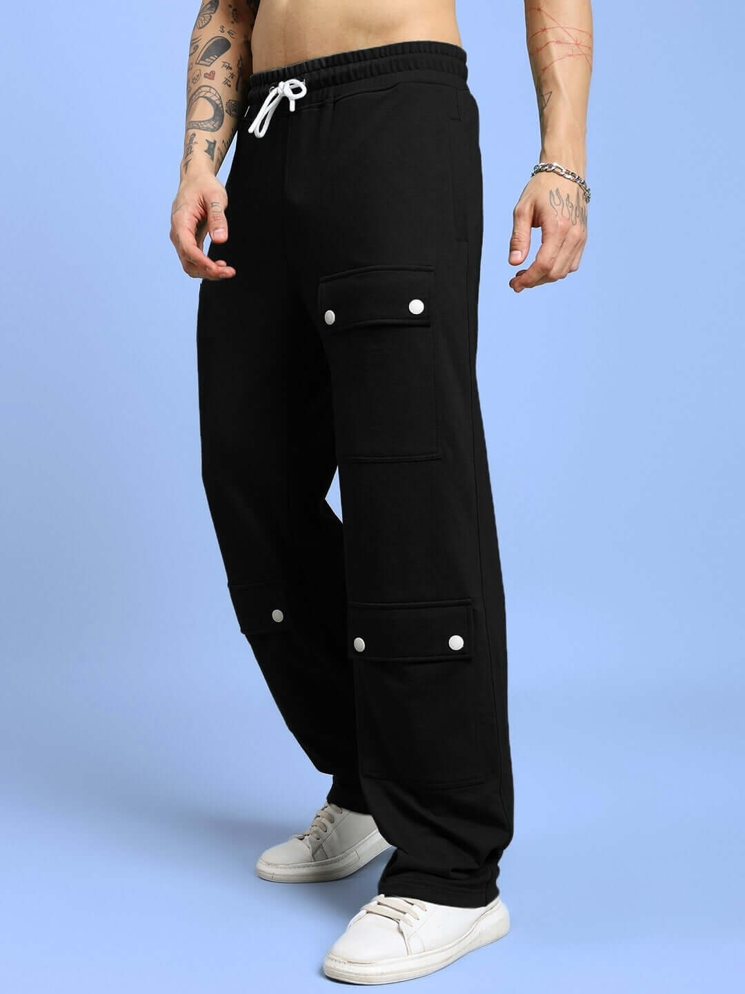 Man wearing AWESOME FLAP POCKET BAGGY JOGGER BLACK showcasing oversized fit and flap pocket details, perfect for streetwear style.