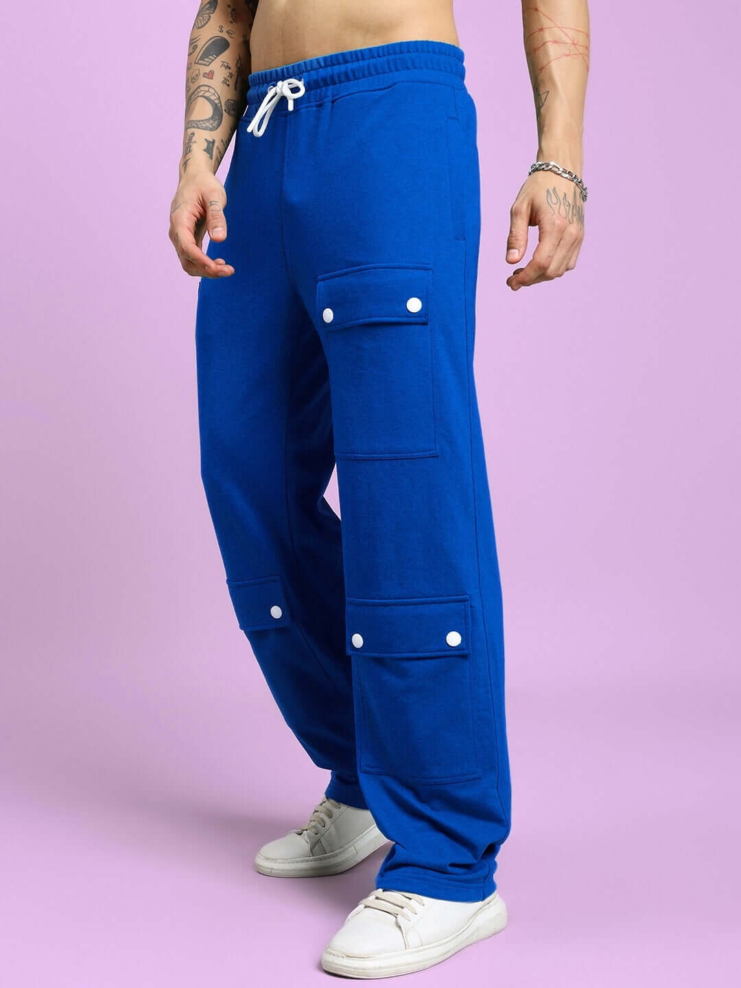 Model wearing AWESOME FLAP POCKET BAGGY JOGGER BLUE with utility pockets and baggy fit for stylish streetwear look.